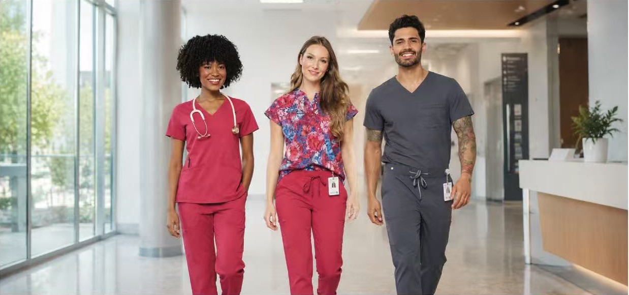 Healthcare professionals wearing Zavat&eacute; scrubs in a medical facility